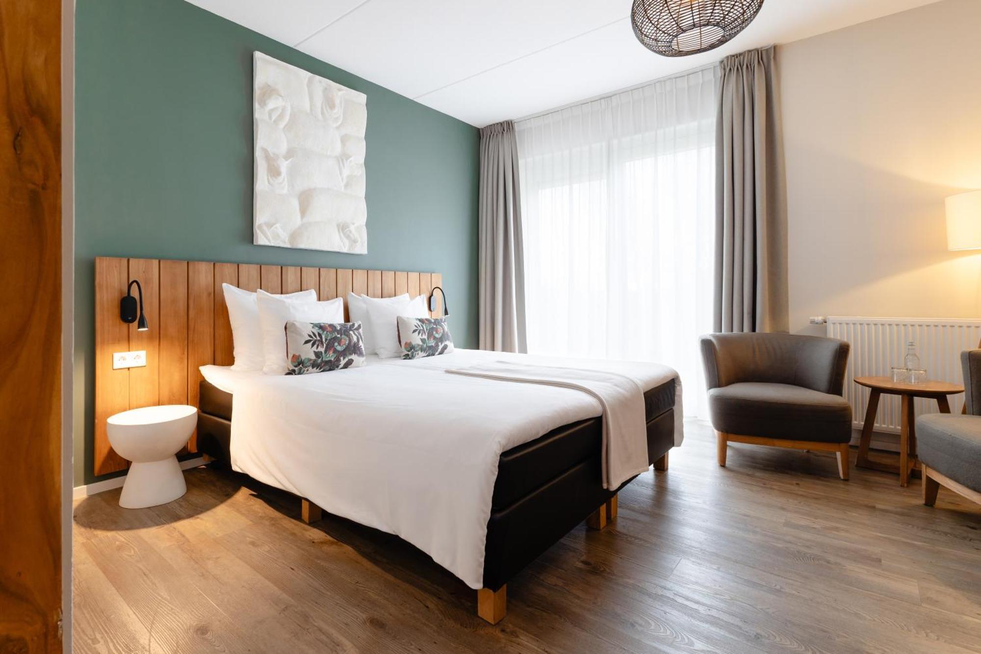 Boutique Hotel Texel De Cocksdorp  Esterno foto A room at the hotel